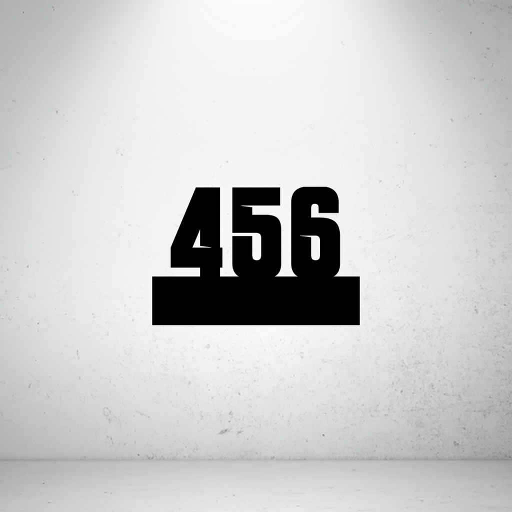 Industrial floating metal house number sign featuring bold laser-cut numbers mounted on a solid horizontal base.