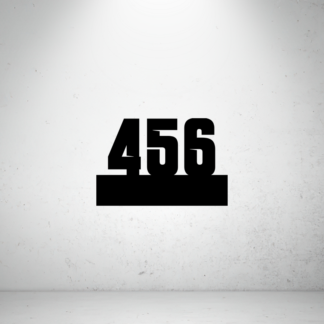 Industrial floating metal house number sign featuring bold laser-cut numbers mounted on a solid horizontal base.