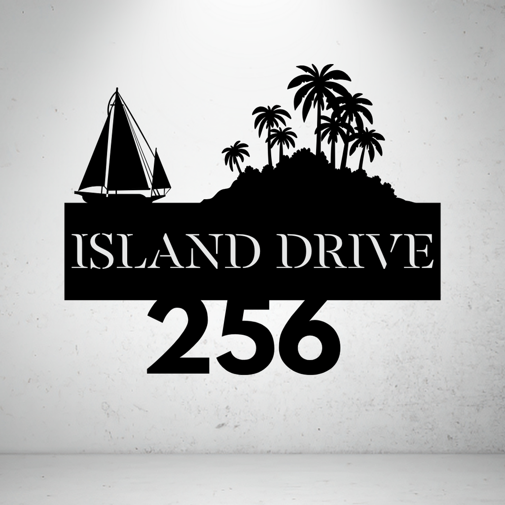 Metal house number sign with sailboat and island design on a grey background