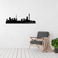 Johannesburg South Africa skyline metal wall art featuring the cityscape displayed above a contemporary chair