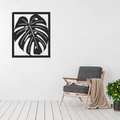 Monstera metal wall art displayed in a modern minimalist interior