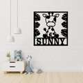 Giraffe jungle wall art hanging in a safari-themed nursery