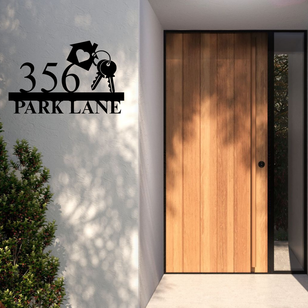 Metal house number and street name sign displayed at a welcoming house entrance
