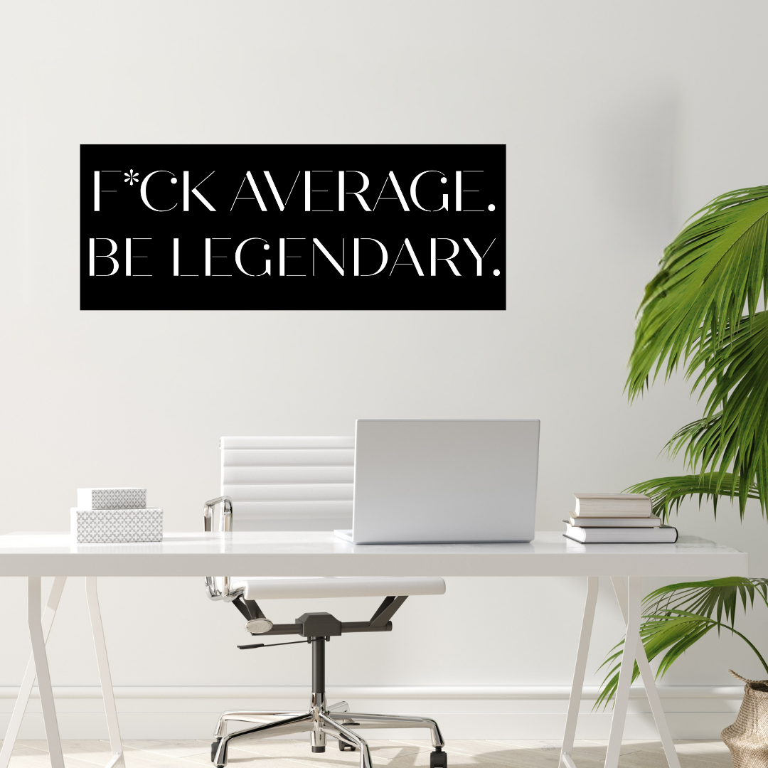 Legendary Living | "Fck Average, Be Legendary" Metal Wall Art mounted in a stylish modern workspace.