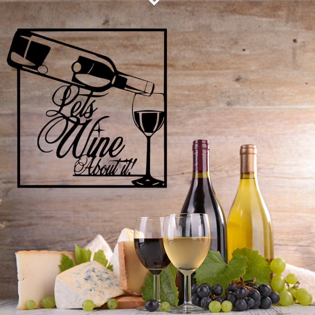 Let's Wine About It | Wine Metal Wall Art showcased above a wine display with bottles, glasses, grapes, and artisan cheeses.