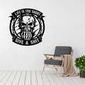 Life Is Short skull metal wall art displayed above a contemporary chair