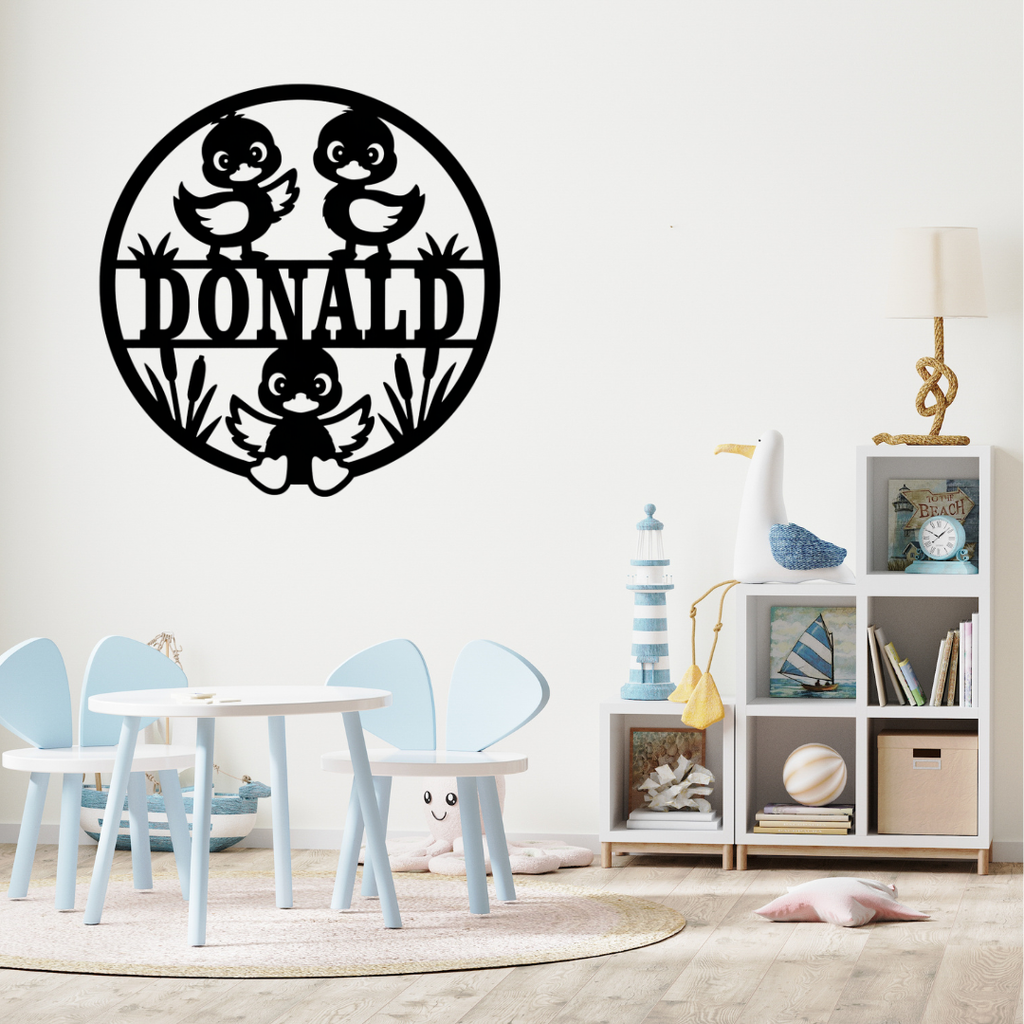 Cute duck-themed décor styled above a nursery crib