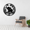 Little Explorer baby elephant metal wall art displayed above a contemporary chair in a modern children's room