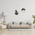 Circular metal wall shelf with planter displayed in a contemporary interior