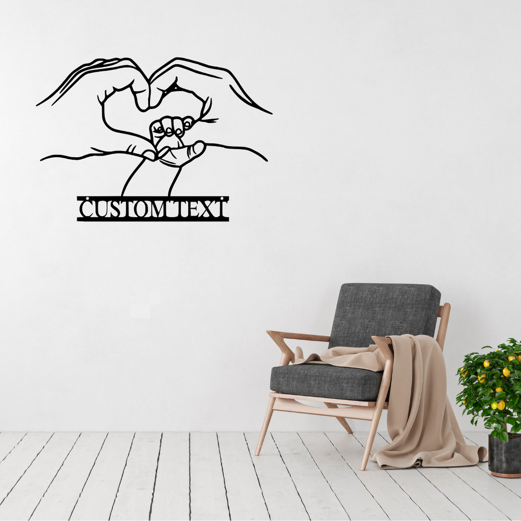 Made for Us personalised hands and heart metal wall art displayed above a contemporary chair in a stylish modern interior