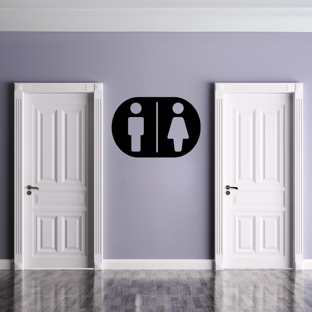Male & Female Toilet Sign | Metal Bathroom Sign displayed on a modern restroom wall between two white doors.