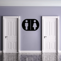 Male & Female Toilet Sign | Metal Bathroom Sign displayed on a modern restroom wall between two white doors.