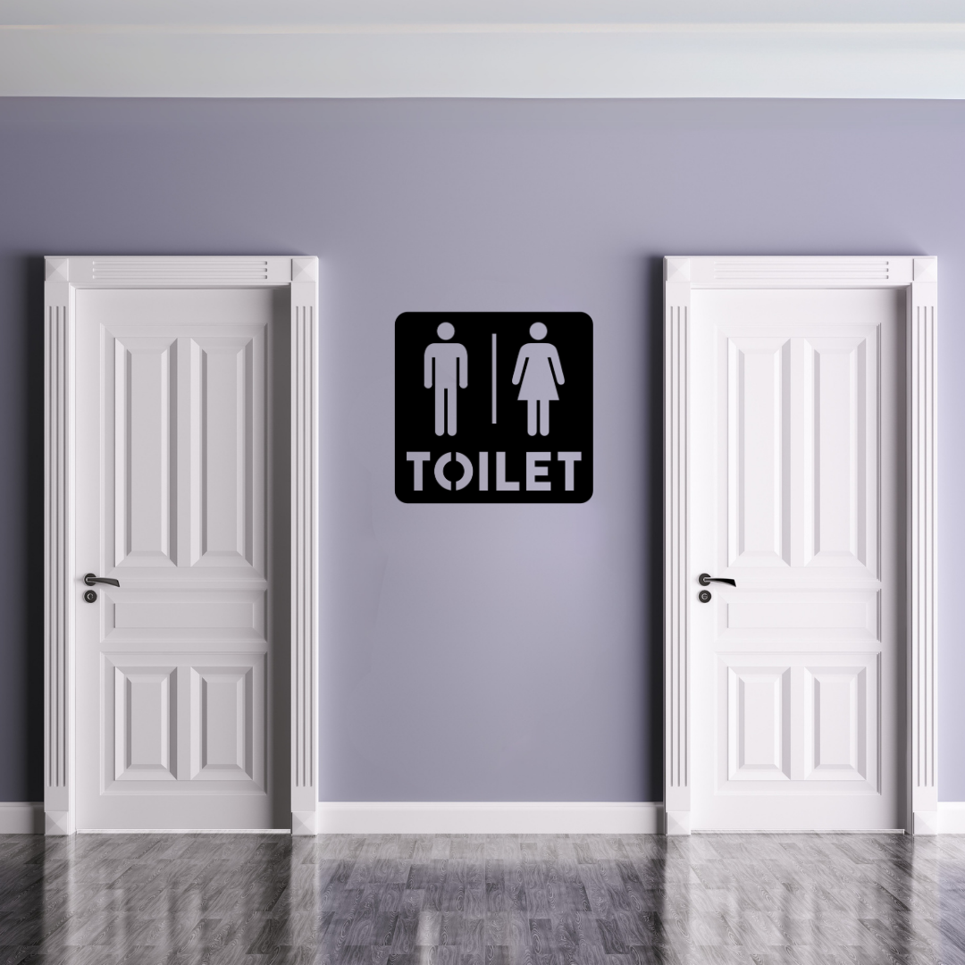 Toilet Sign | Male & Female Restroom Sign displayed on a modern restroom wall between two white doors.