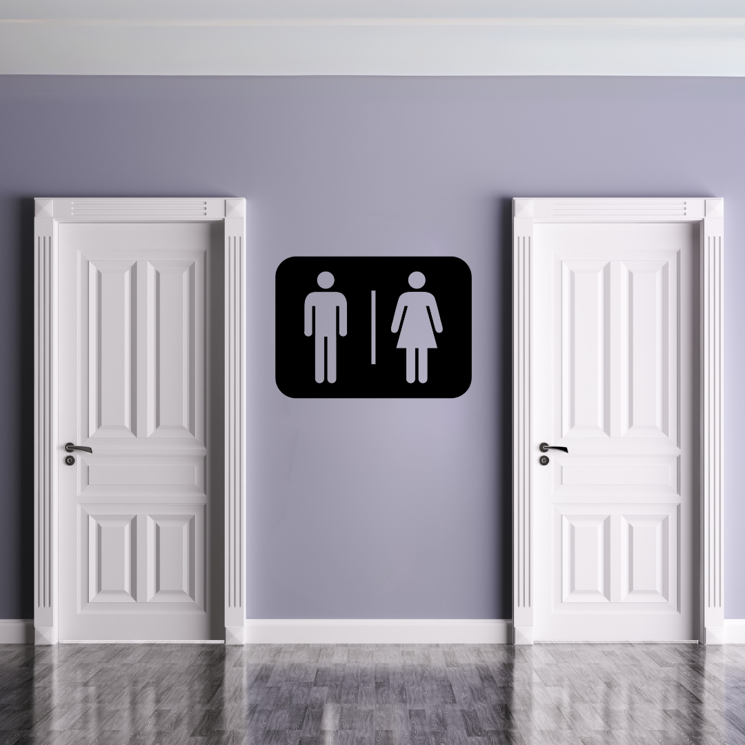 Male & Female Toilet Symbol | Metal Bathroom Sign displayed on a modern restroom wall between two white doors.
