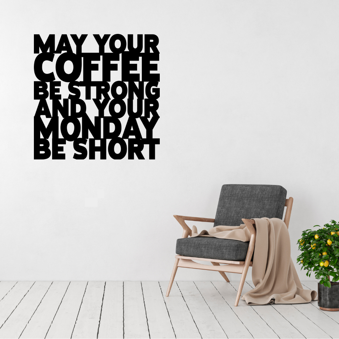 May Your Coffee Be Strong & Your Monday Be Short | Funny Coffee Metal Wall Art displayed above a modern accent chair in a contemporary living space.