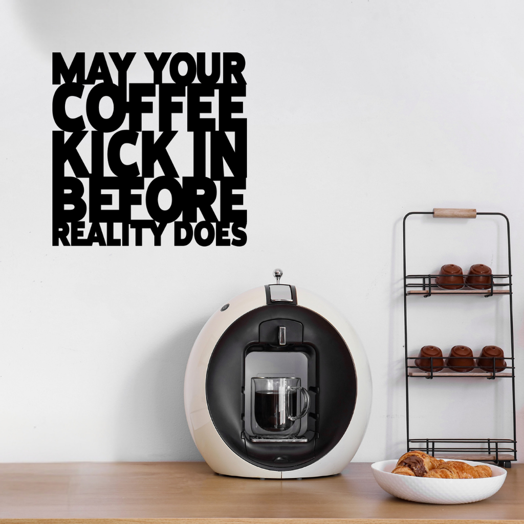 May Your Coffee Kick In Before Reality Does | Funny Coffee Metal Wall Art showcased above a stylish home coffee station with an espresso machine and coffee accessories.