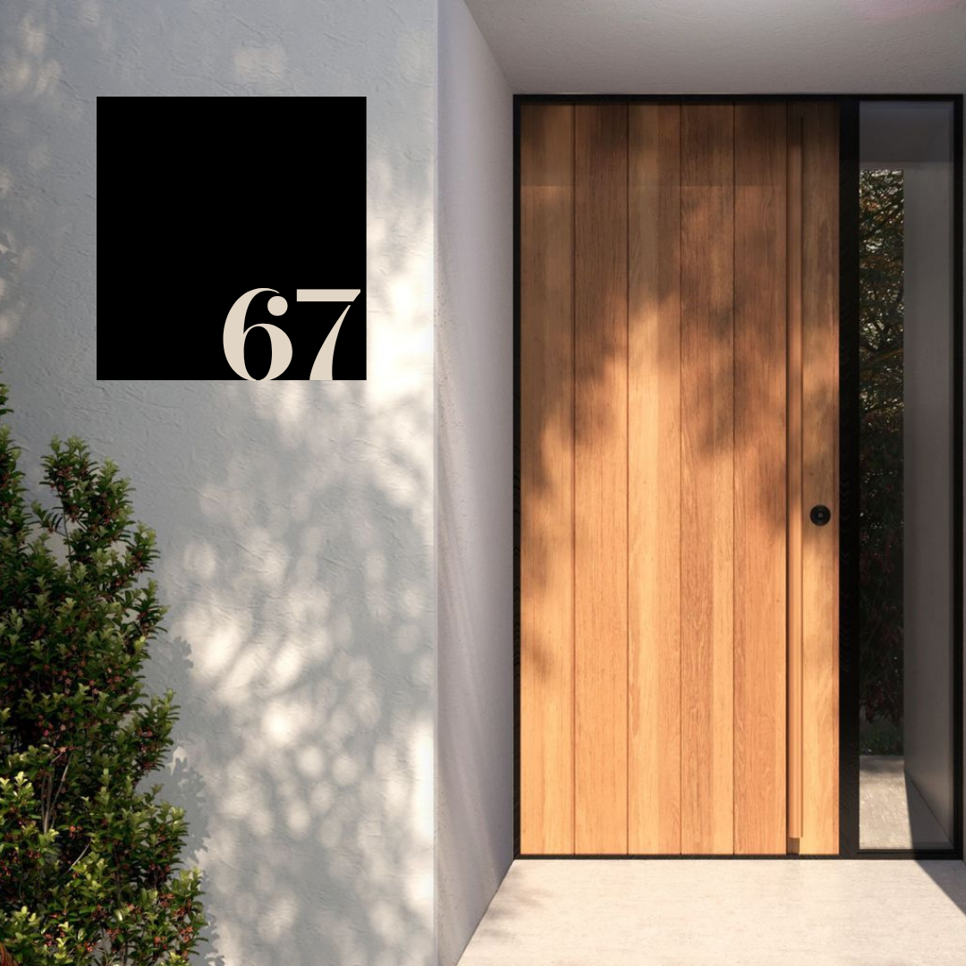 Metal house number sign mounted at a sleek contemporary house entrance