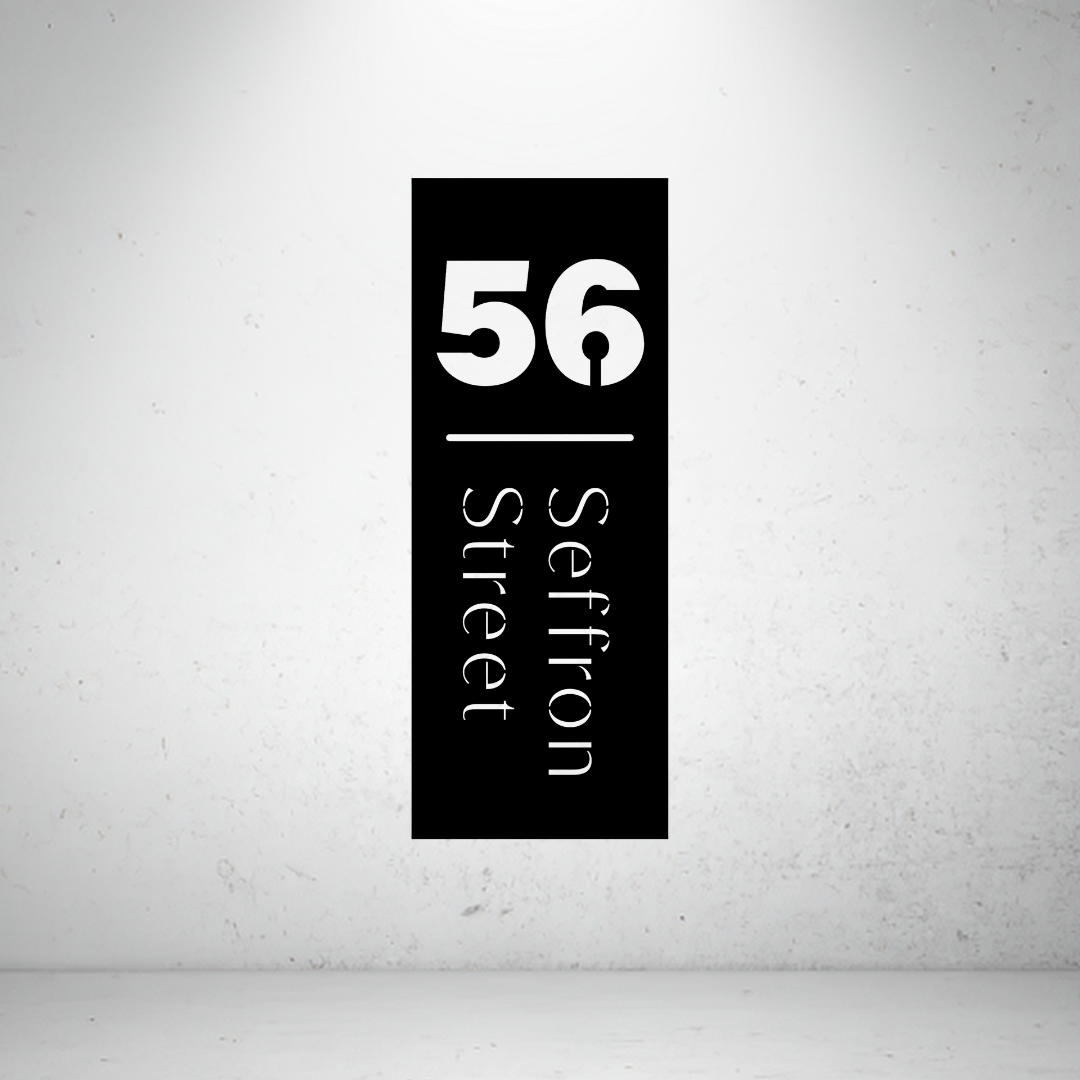 Modern vertical metal address sign featuring a custom house number and vertically displayed street name.