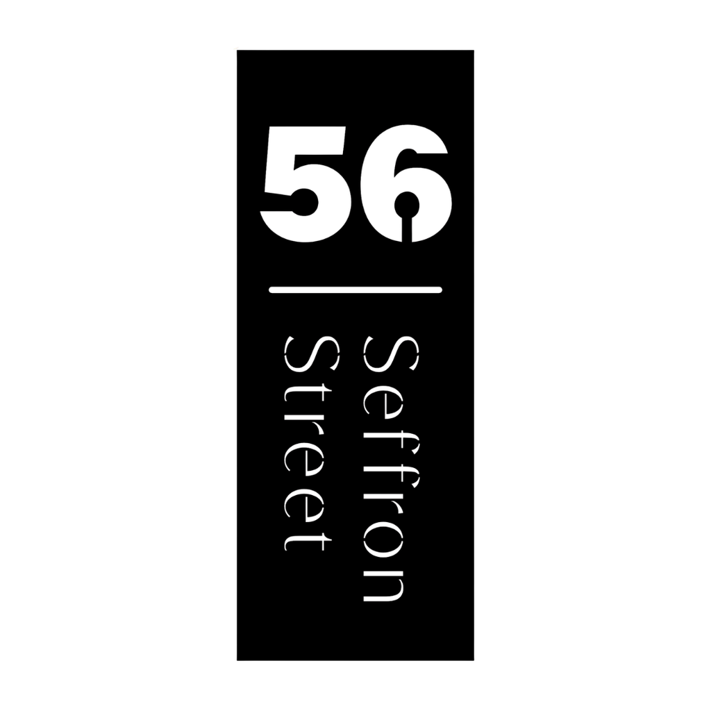 Custom minimalist vertical metal address plaque with house number and street name for contemporary homes.