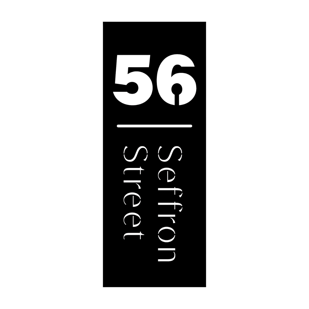Custom minimalist vertical metal address plaque with house number and street name for contemporary homes.