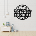 Fun monster metal wall art displayed in a colourful playroom