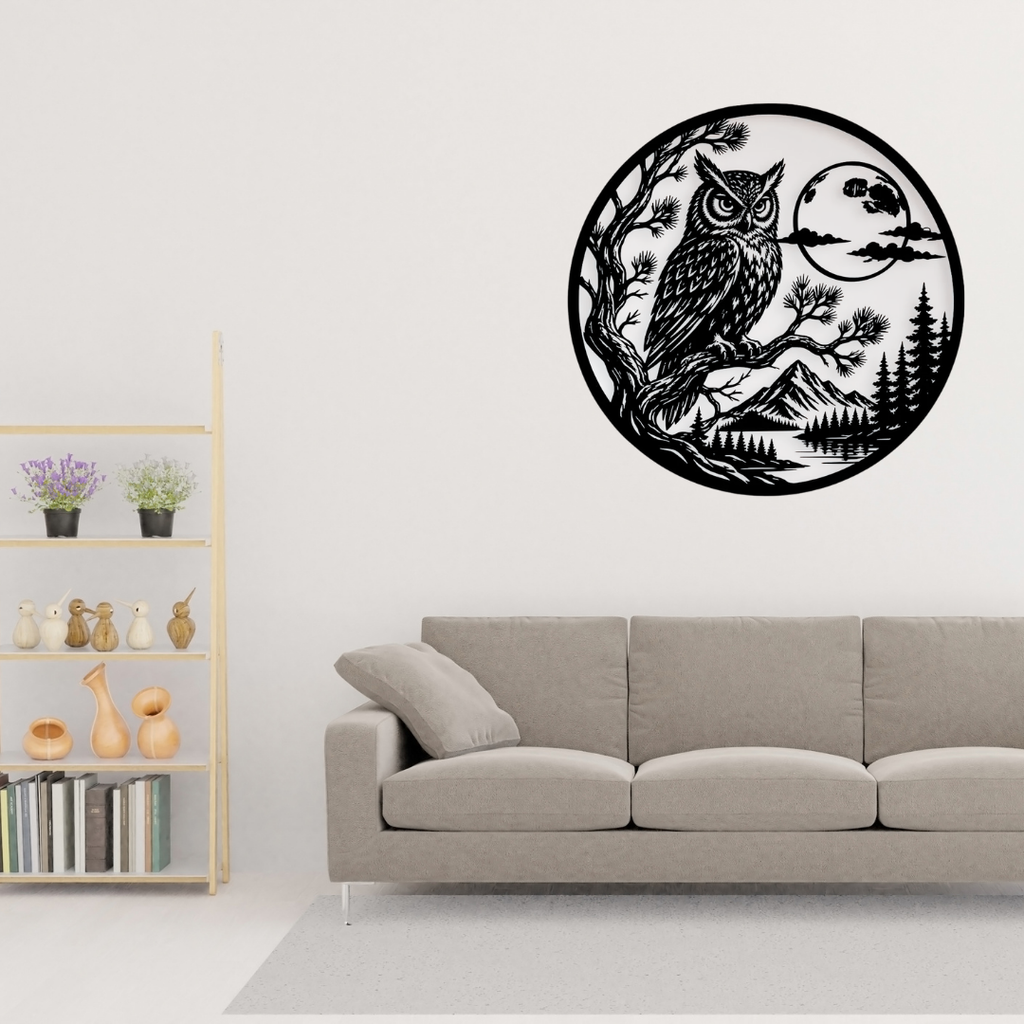 Moonlit Wisdom | Owl Circular Metal Wall Art showcased above a contemporary sofa, creating a striking nature-inspired focal point with an owl, moonlit forest, mountains, and lake in precision-cut black metal.