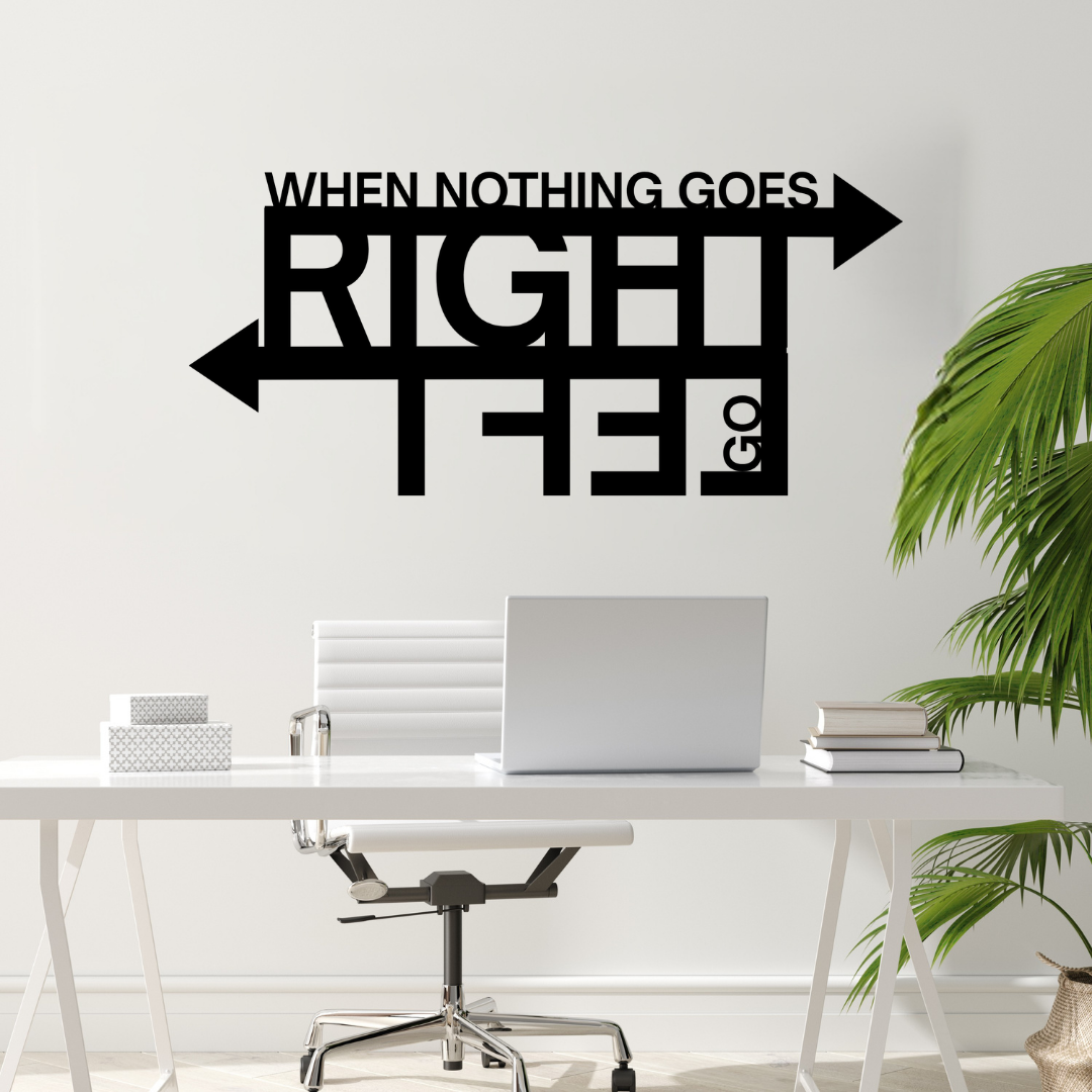 New Directions | When Nothing Goes Right Go Left Metal Wall Art showcased in a contemporary office workspace.