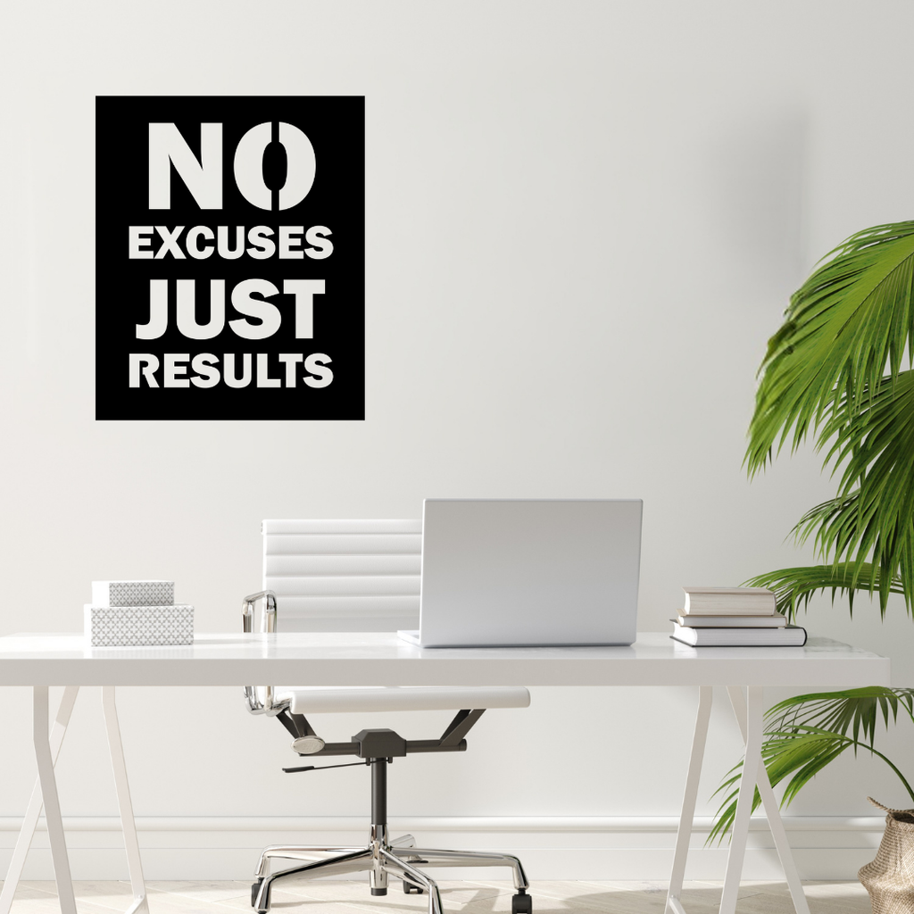 No Excuses motivational metal wall art displayed above a modern office workspace.