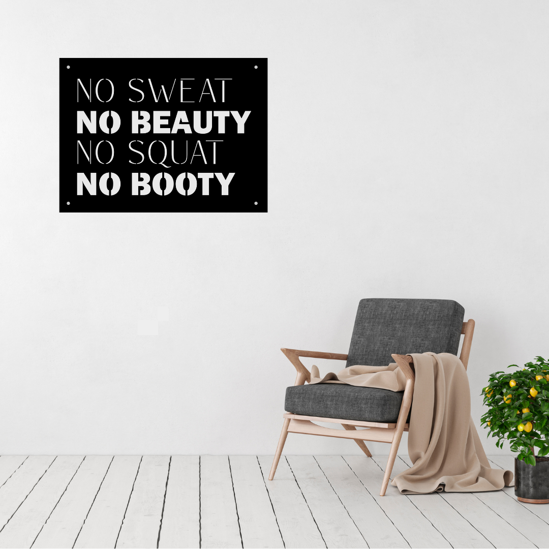 No Sweat No Beauty No Squat No Booty motivational gym metal wall art displayed above a modern accent chair, featuring bold fitness typography in a laser-cut steel design.