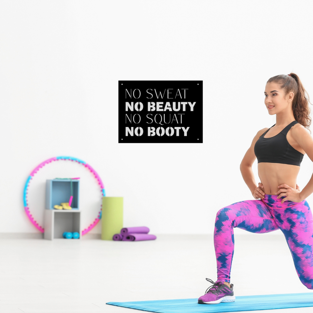 No Sweat No Beauty No Squat No Booty motivational metal wall art displayed in a modern home gym beside a woman exercising, inspiring strength and consistency.