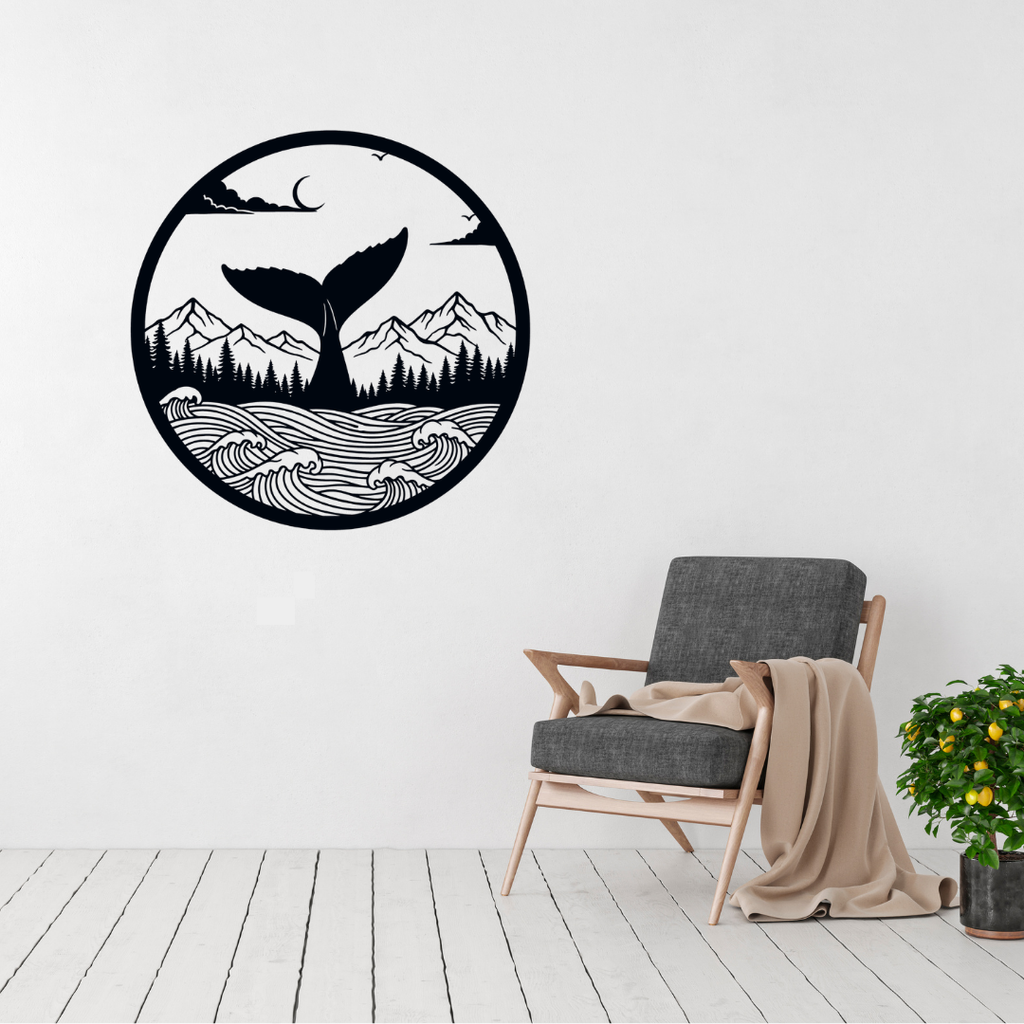 Ocean Freedom whale and mountain metal wall art displayed above a contemporary chair
