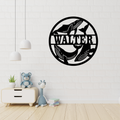 Whale metal wall art displayed in a coastal-inspired living room