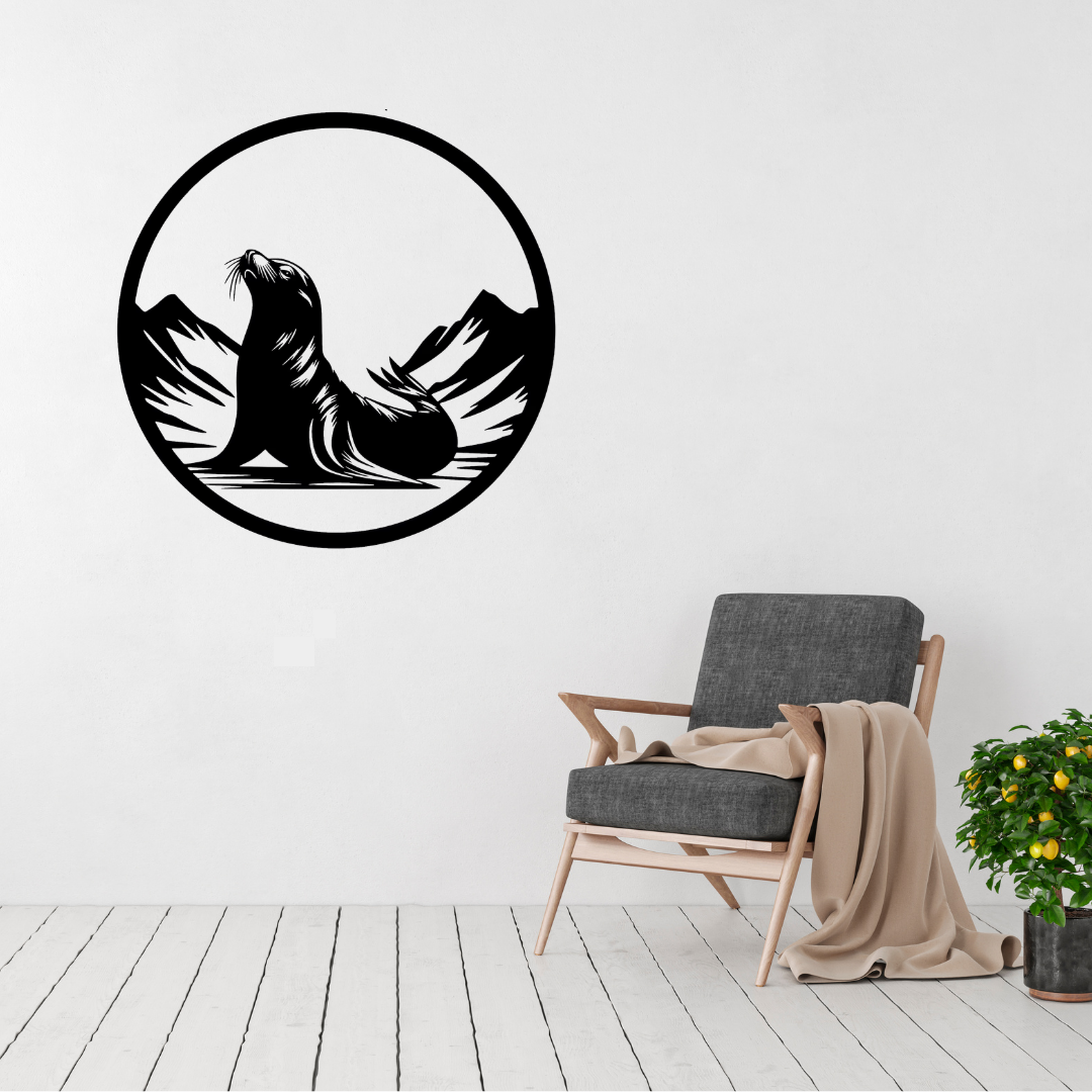 Ocean Guardian | Sea Lion Metal Wall Art displayed in a bright modern living room, showcasing a graceful circular black metal design featuring a majestic sea lion resting among coastal mountains. Precision laser cut metal artwork that brings a calm ocean-inspired focal point to contemporary homes, beach houses and coastal interiors.