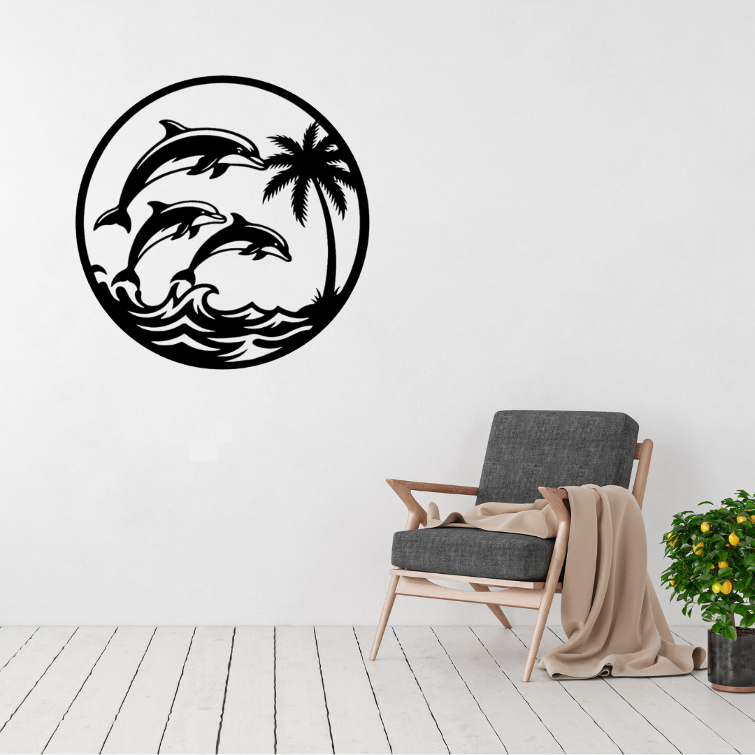 Ocean Harmony | Dolphin Family Metal Wall Art displayed in a bright modern living room, featuring three playful dolphins leaping above ocean waves beside a tropical palm tree in a circular black metal design, perfect for coastal homes, beach houses and contemporary wall décor.
