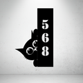 Metal house number sign with playful cat silhouette on a grey background