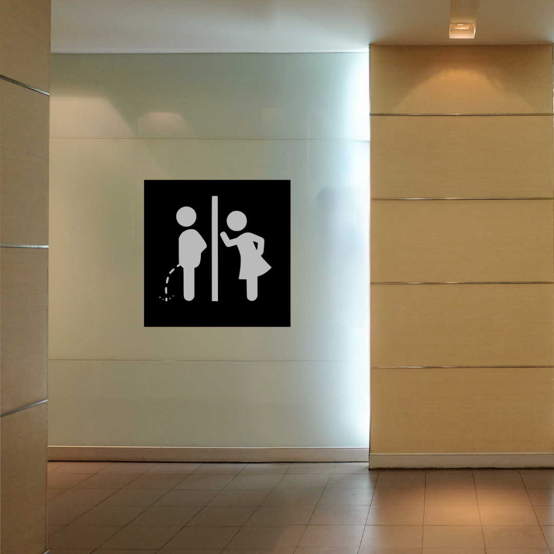 Please Remain Seated Funny Toilet Metal Sign displayed in a commercial restroom setting.