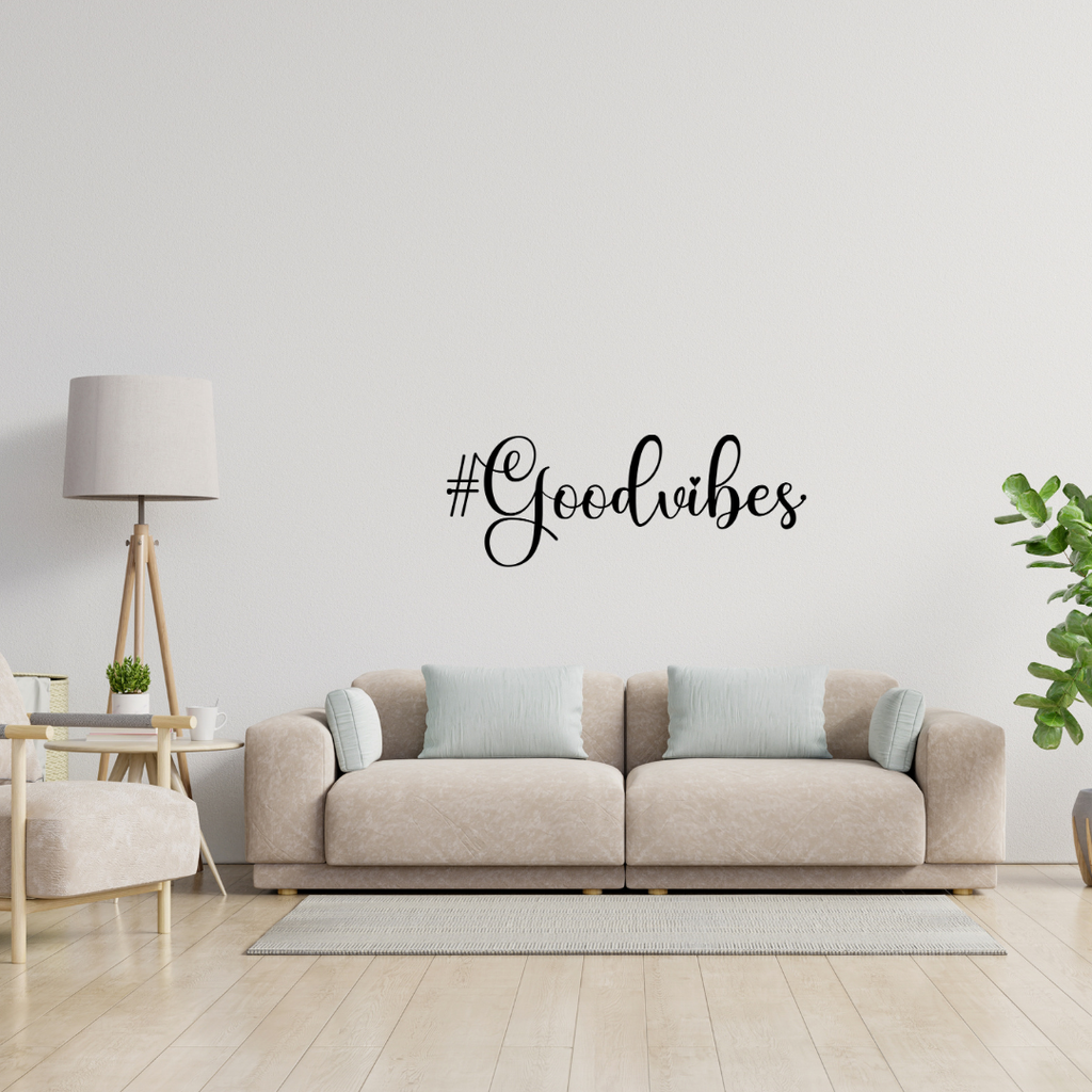 Positive Energy | #GoodVibes Metal Wall Art showcased above a modern sofa in a contemporary living room.