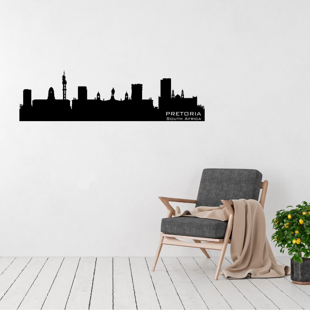 Pretoria South Africa skyline metal wall art displayed above a contemporary chair