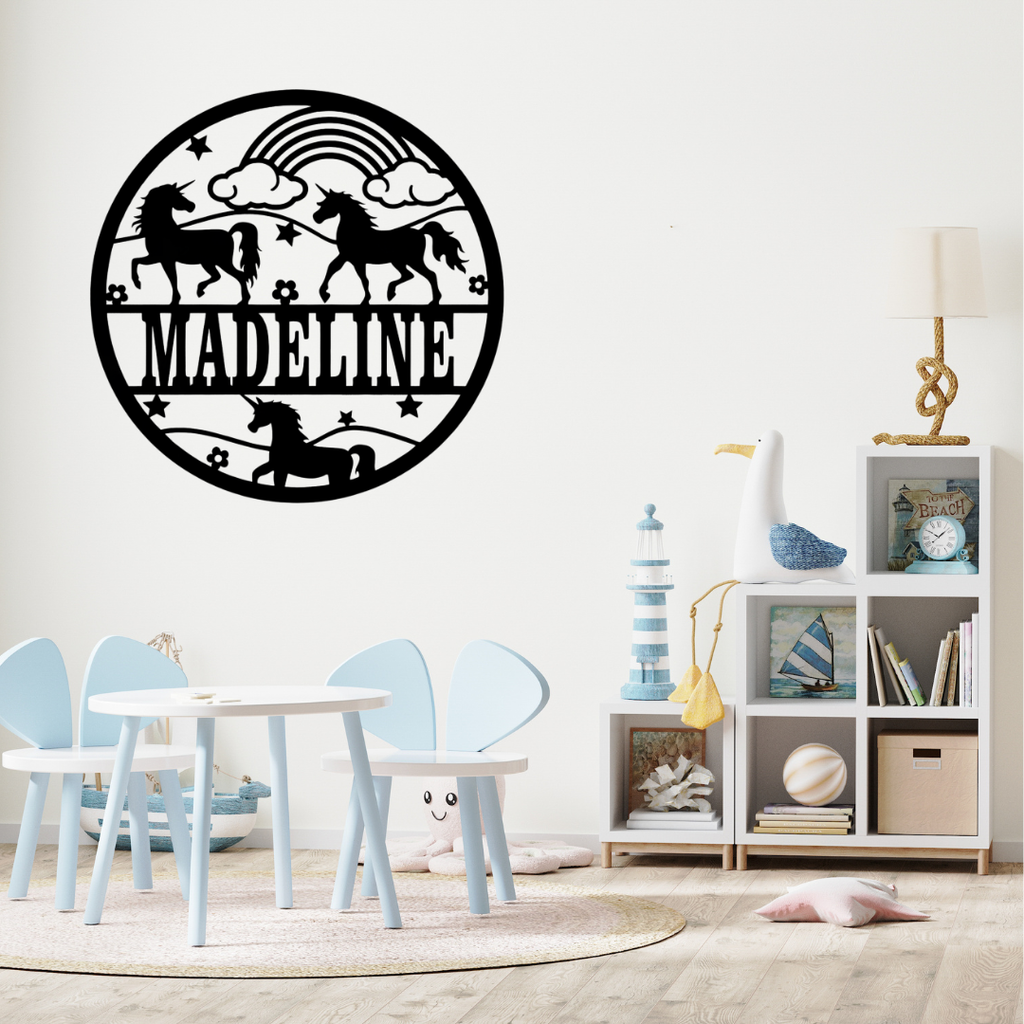 Magical unicorn wall décor styled above a pastel nursery crib