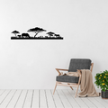 African savanna silhouette metal wall art featuring a rhino, guinea fowl, zebra and acacia trees in a room with a contemporary chair