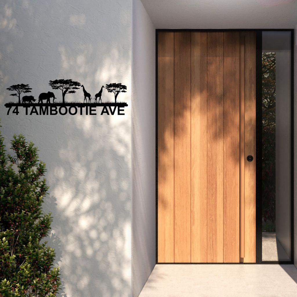 Metal house number safari address sign displayed at a lodge-style house entrance