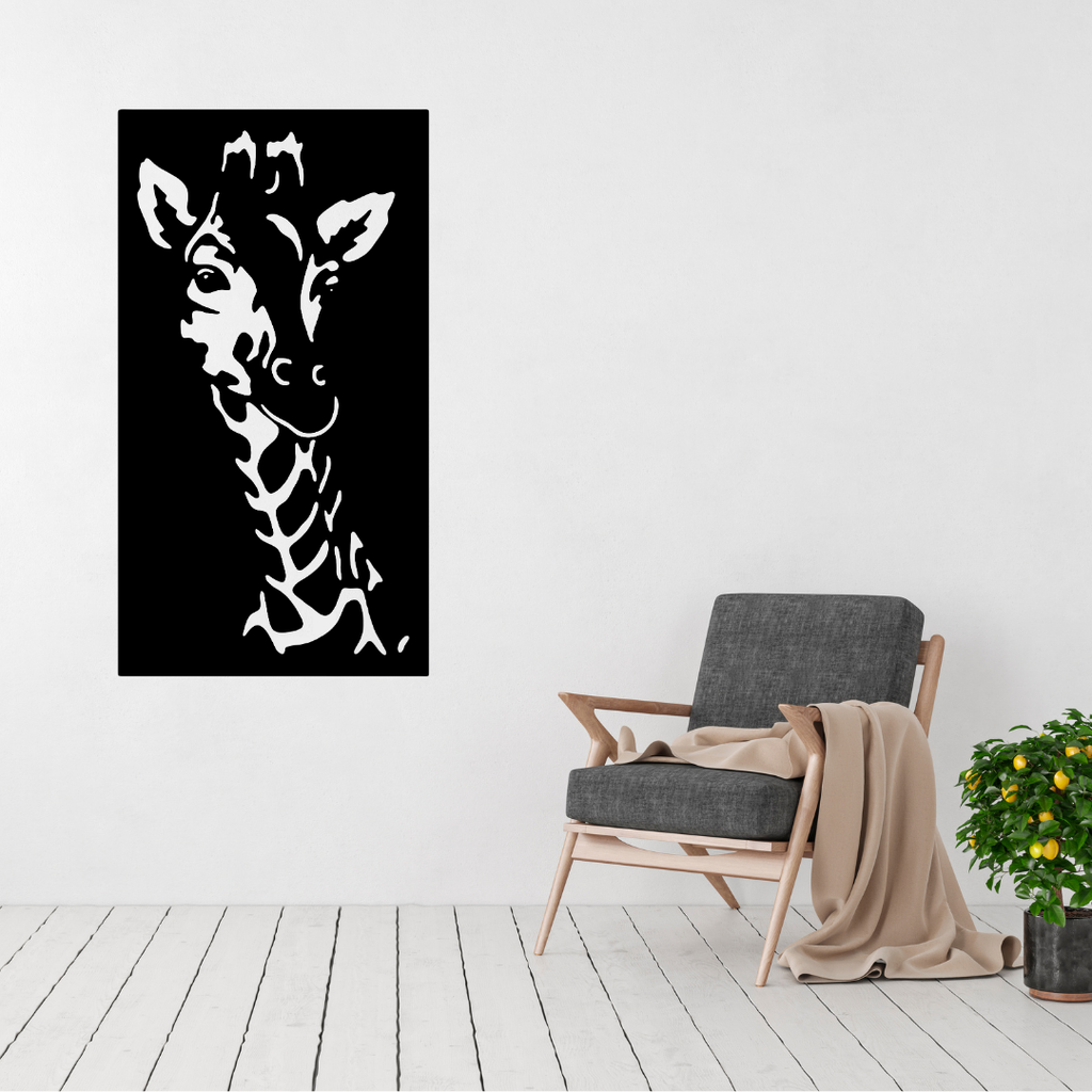 Savannah Grace | Giraffe Metal Wall Art displayed on a modern white wall above a contemporary armchair.