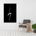 Sculpted Grace minimalist woman metal wall art displayed above a contemporary chair in a modern interior