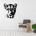 Silent Majesty Leopard Face Metal Wall Art displayed in a bright, contemporary living room above a modern armchair.