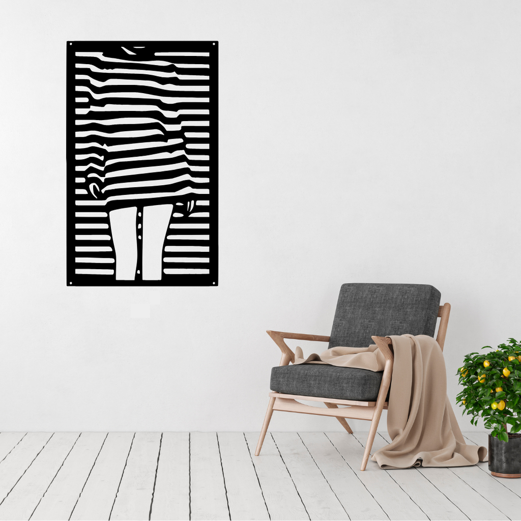 Simply Her minimalist woman metal wall art displayed above a contemporary chair in a modern interior