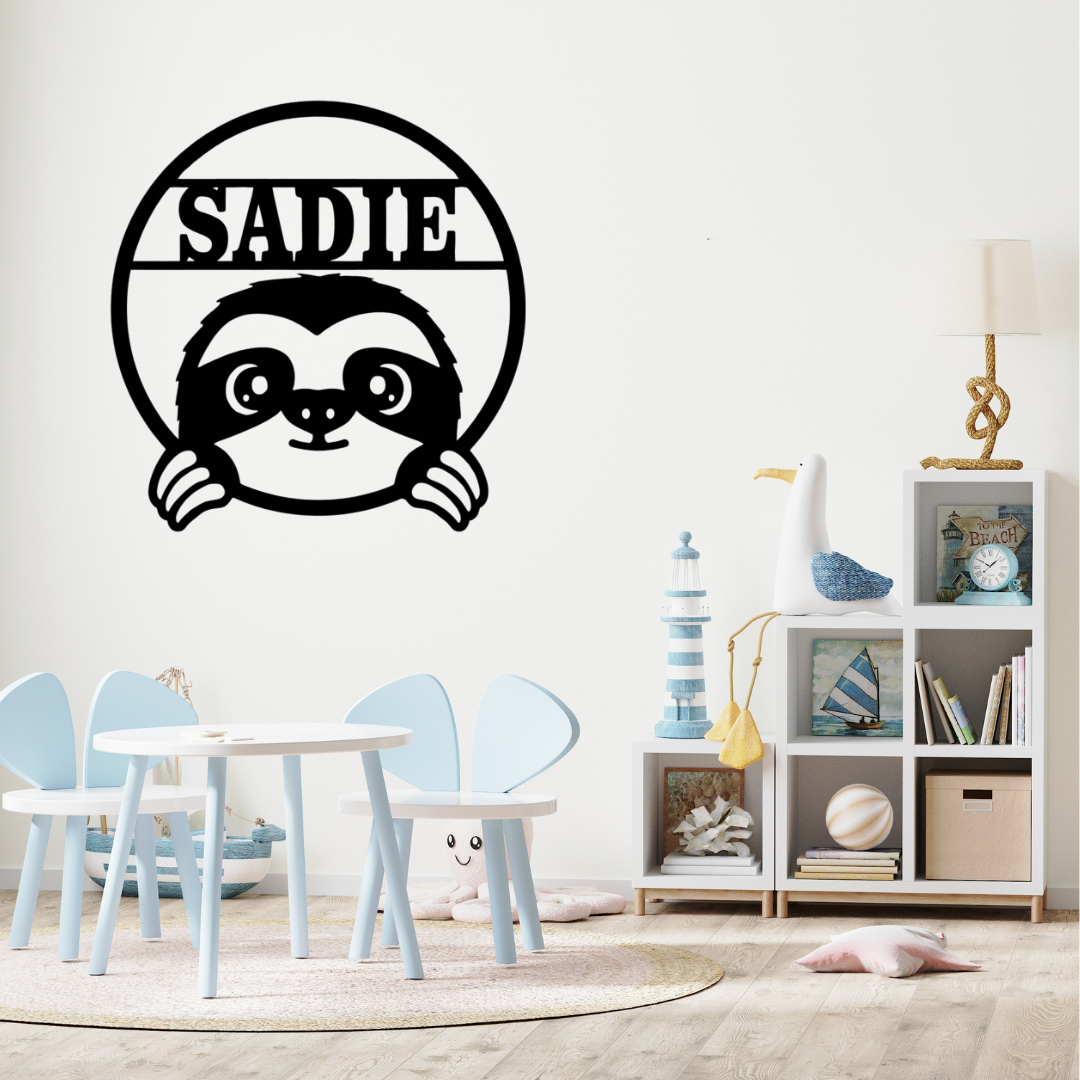 Personalised sloth wall décor styled above a child’s bed with tropical décor accents