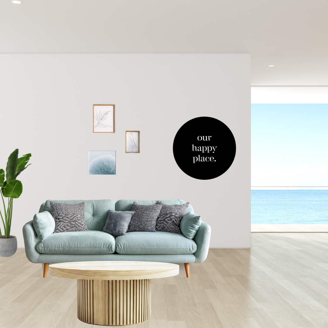 Spaces We Love | Our Happy Place Round Metal Wall Art showcased in a bright contemporary living room above a sofa.