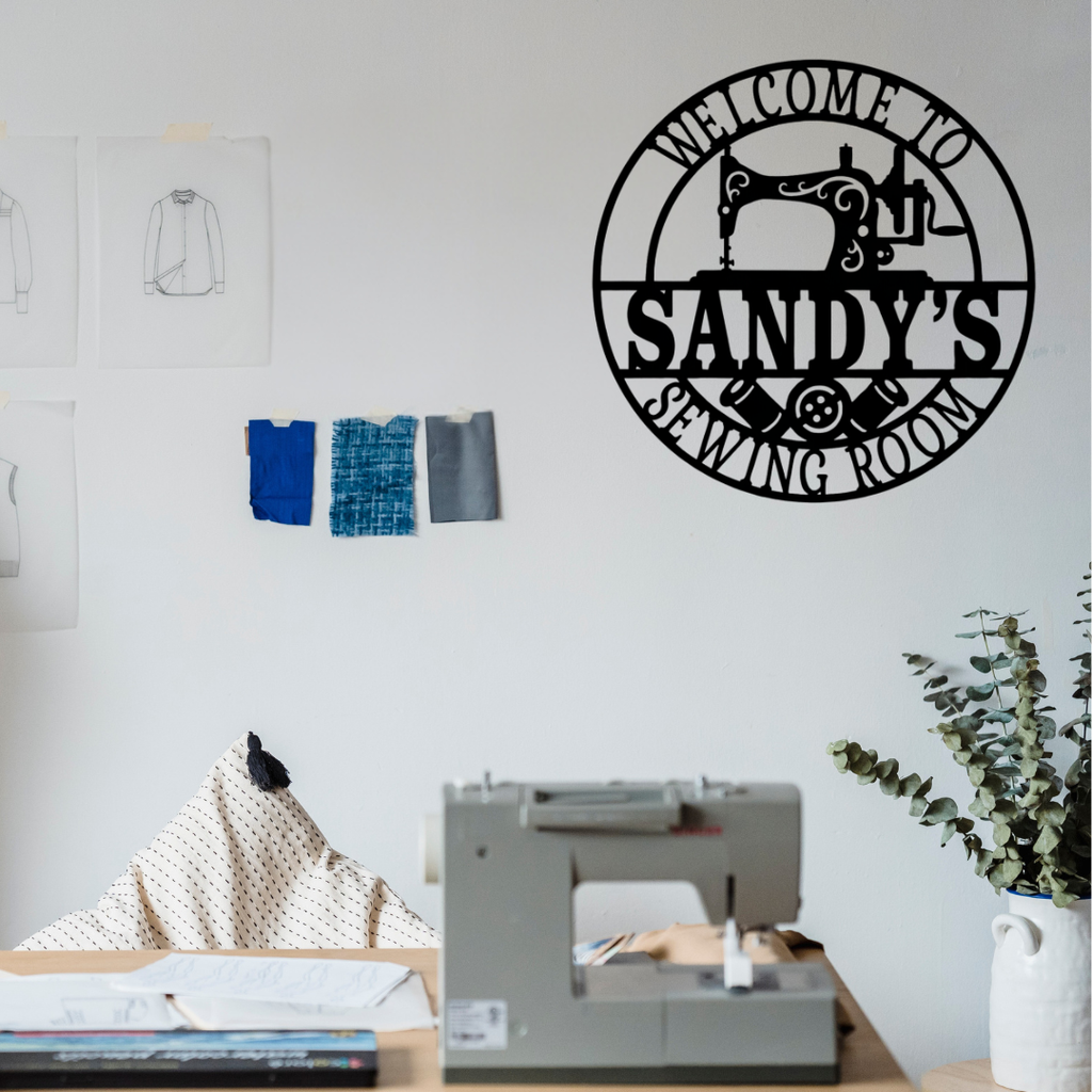 Sewing room metal wall sign displayed in a creative craft studio