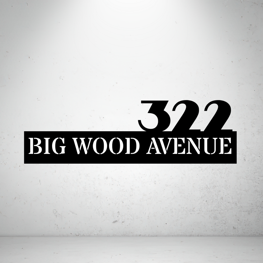 Metal house number sign with bold typography on a grey background