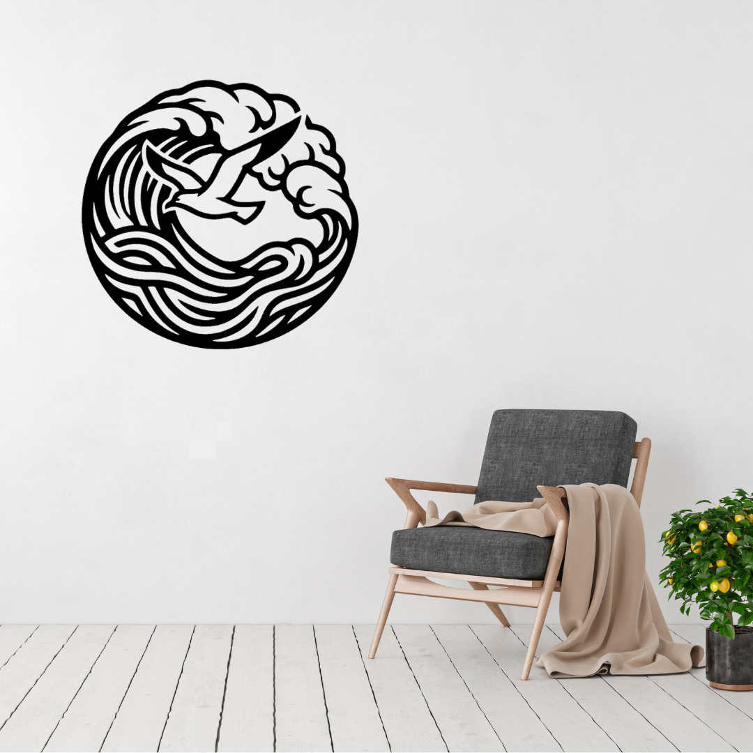 Freedom at Sea | Seagull Wave Metal Wall Art displayed in a bright modern living room, featuring a soaring seagull framed by a curling ocean wave in a circular black metal design, perfect for coastal homes, beach houses and contemporary wall décor.